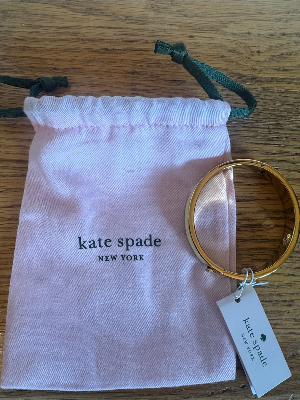 kate spade Gold Hinged Bangle with Light Pink Drawstring Pouch
